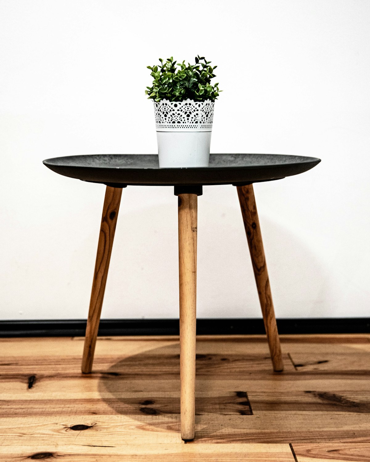 A small oak side table with a curved base