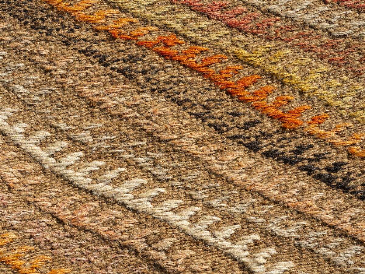 A camel and chalk striped flatweave wool rug